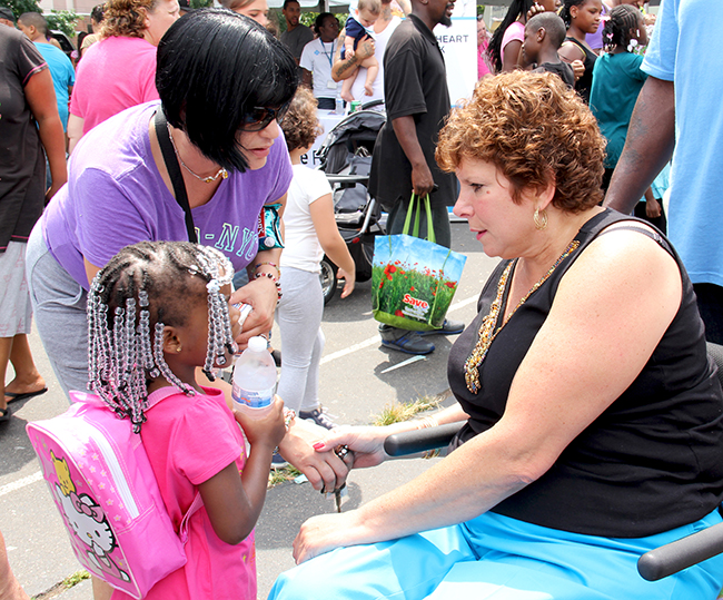 Sen. Christine M. Tartaglione  (right) talks about the upcoming school year with constituents at her annual community festivalon Thursday, Aug. 8, 2013.